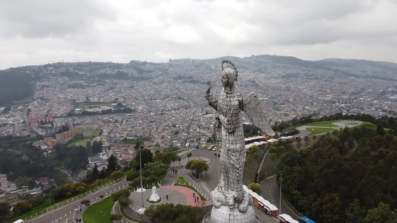 Aerial orbit of El Panecillo Quito Ecuador. Capital City in the Andes mountains. Cityscape aerial orbit of famous statue in Ecuador