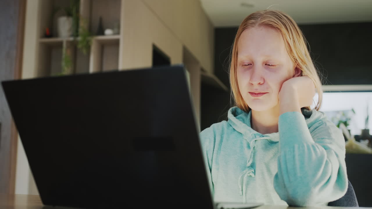 The child is crying at the laptop monitor. Problems in study or communication concept