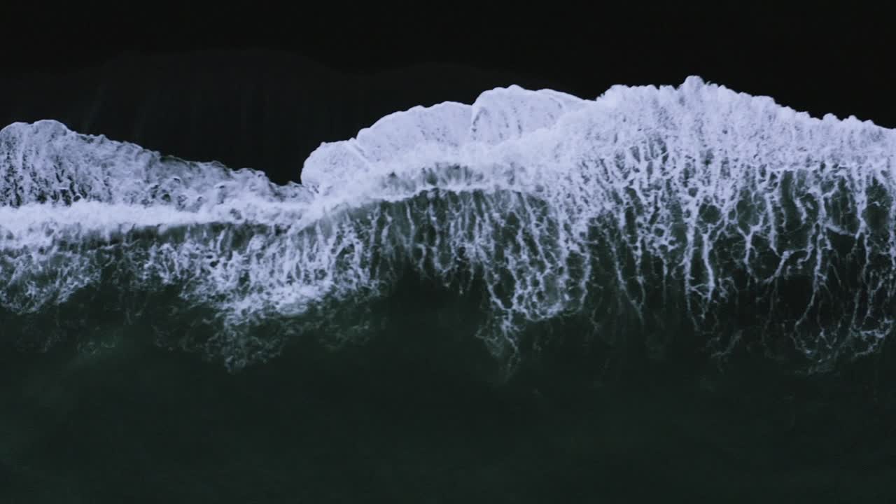 Atlantic Ocean Waves Swashing At The Coast - aerial top view, sideway shot