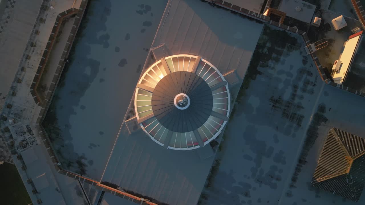 Sunset spin reveal of Art Deco old seaside building Marine Hall Fleetwood with landing seagull