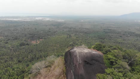 Big-granite-boulder-at-Batu-Beginde-Belitung-Indonesia,-aerial