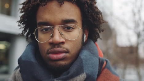 young man in winter cityscape