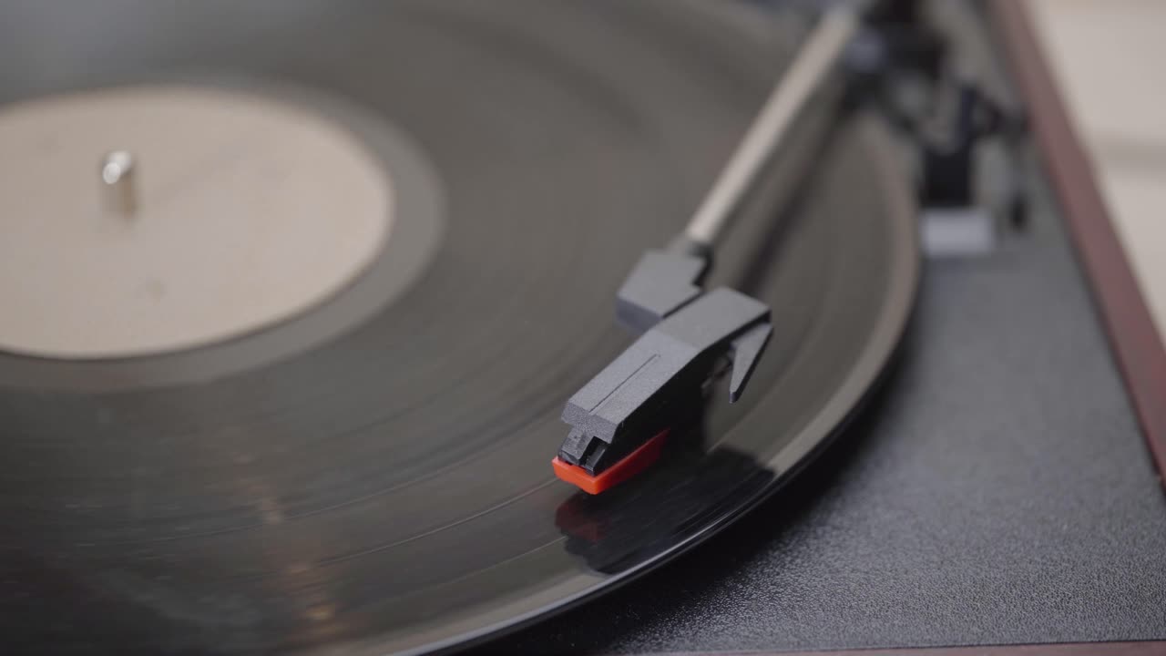 Hand Starting and Stopping a Vinyl Record on a Turntable