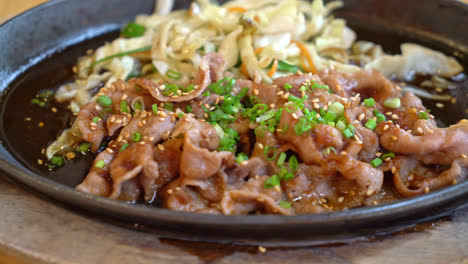 teriyaki pork in hot pan with cabbage - japanese food style