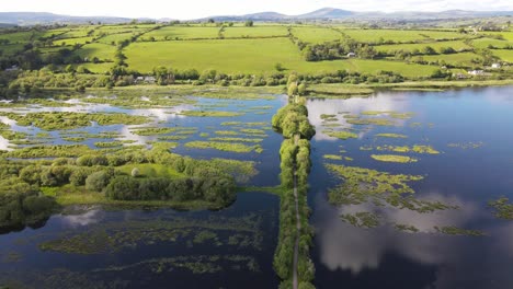 A-walkway-on-water-an-aerial-footage-on-a-sunny-day-with-cloud-reflections