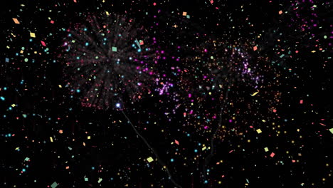 sparkling particles in colorful fireworks animation over black background
