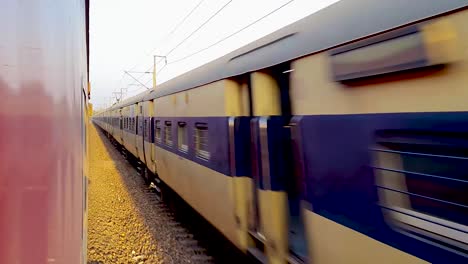 passenger-train-running-on-track-crossing-each-other-from-opposite-direction-at-morning-video-is-taken-at-new-delhi-railway-station-on-Aug-04-2022