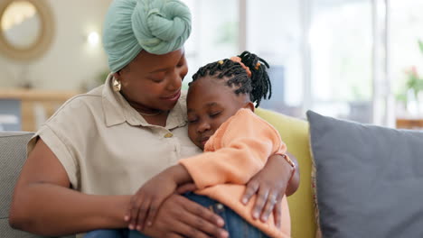 mother hug sleeping child on couch for love