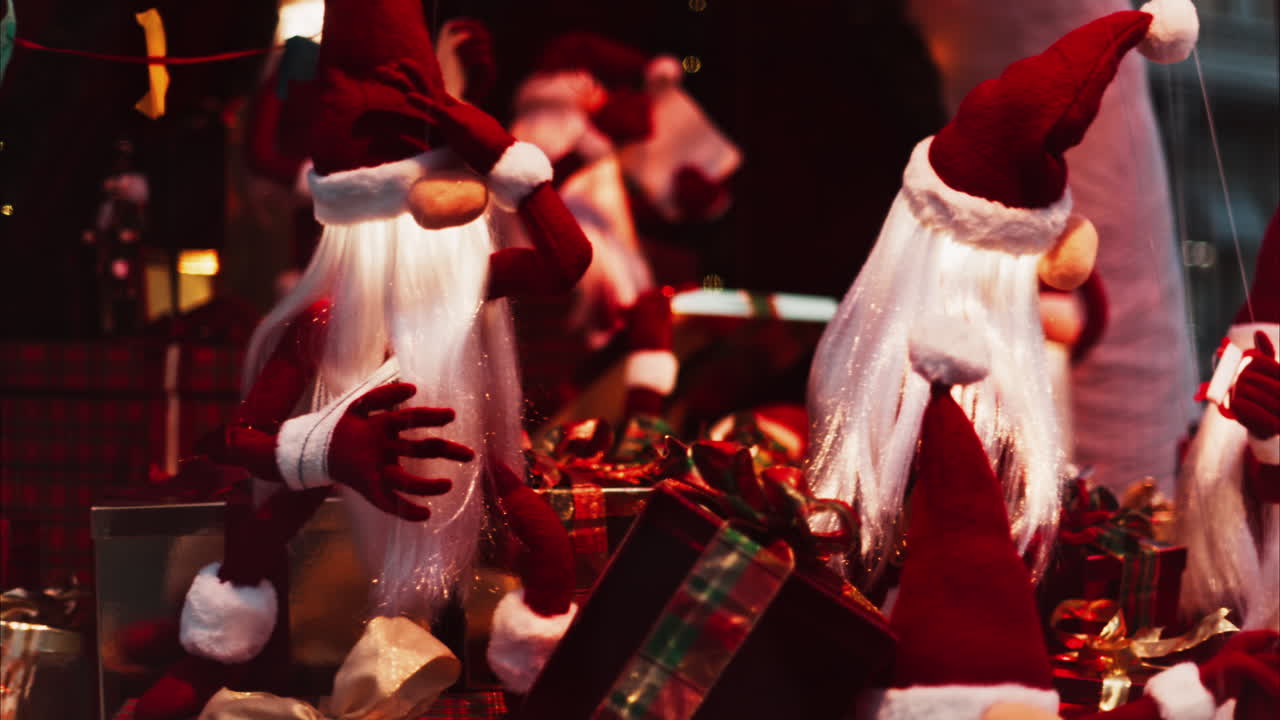 Multiple Santa Claus Christmas decorations moving in bubbles in the courtyard of the Monte Carlo Casino