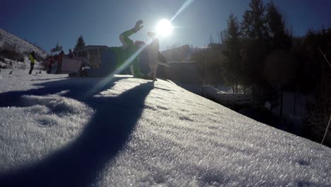 4k footage: young man enjoys playing with bull terrier on a sunny winter day