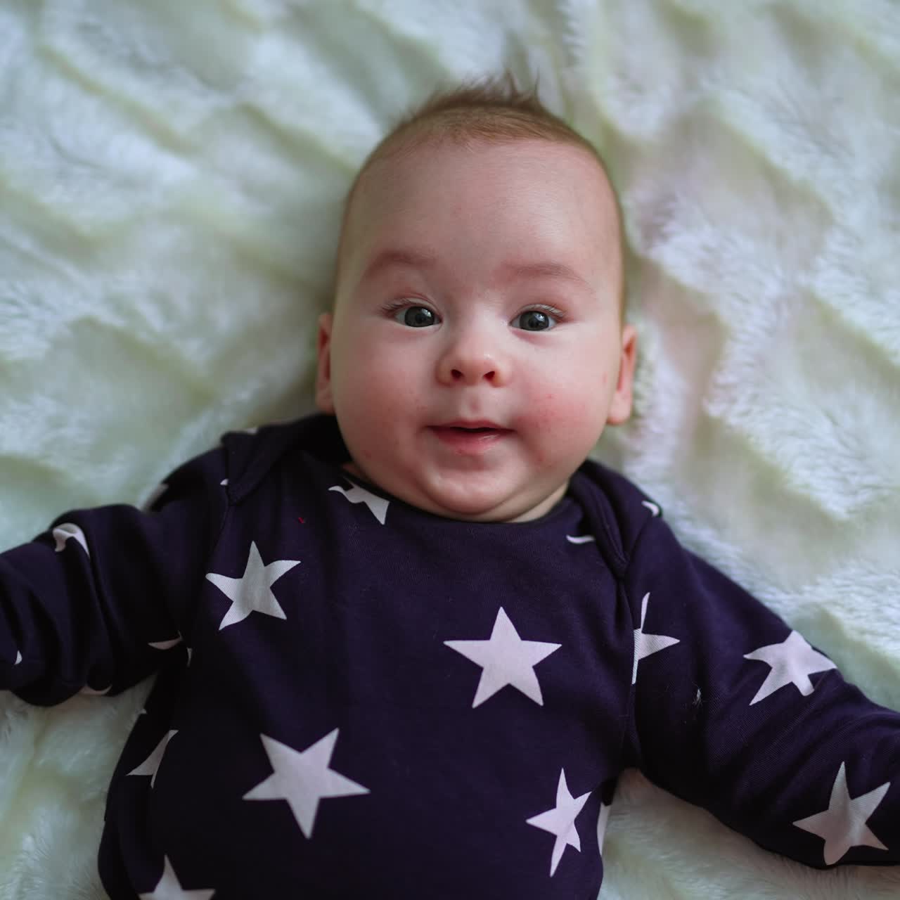 Cute baby on a bed. Adorable newborn child