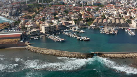 chania port - boats moored at chania marina with neoria venetian shipyards in greece