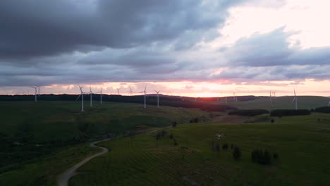 aerial footage of windfarm at sunset