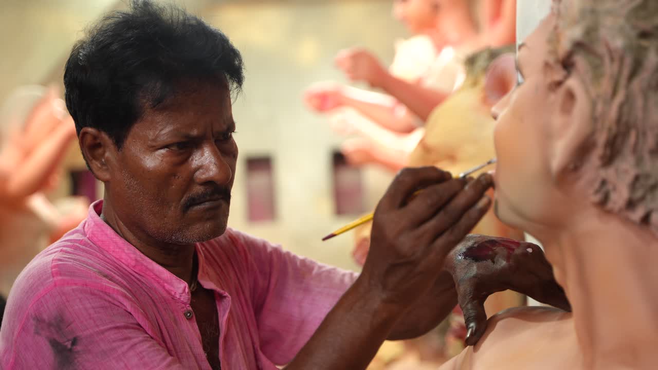 In Kumortuli, idol artists are making idols of Durga, the revered deity of Hinduism. The work of making these idols starts from June and these potters make many idols till November.