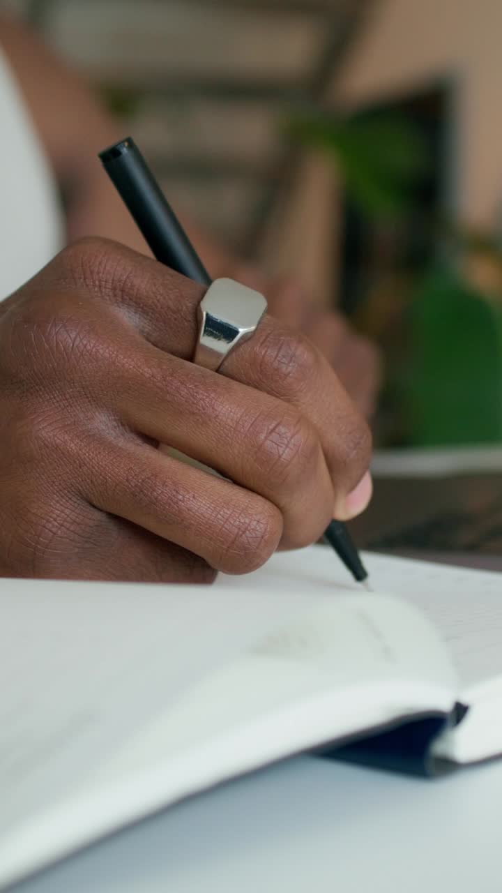 Person writing in a notebook