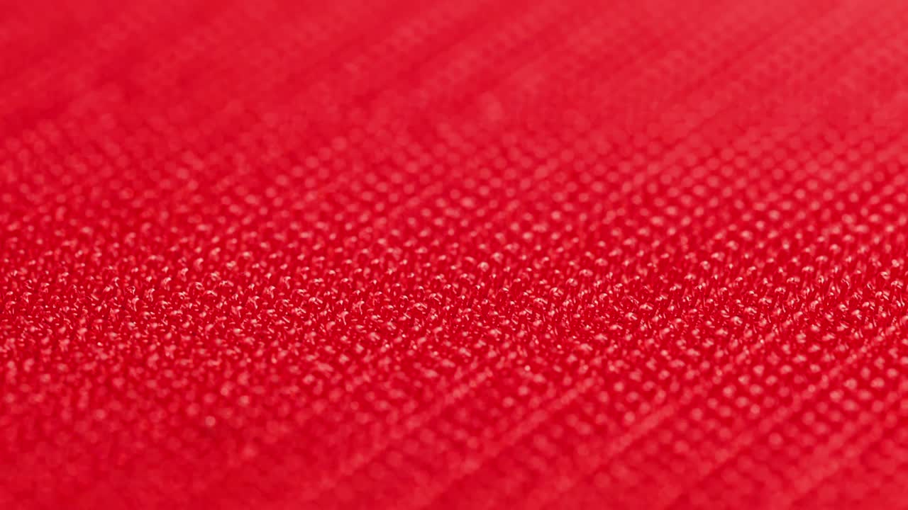 close-up macro view of red velcro surface with micro hooks
