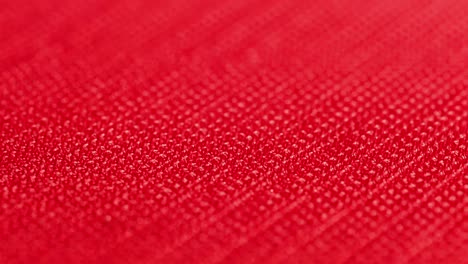 close-up macro view of red velcro surface with micro hooks