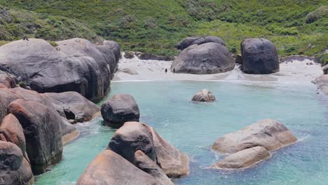 People-walking-along-beach-at-Elephant-Rocks-in-Denmark,-Western-Australia