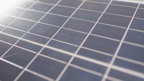 Video-of-close-up-of-solar-panel-on-white-background