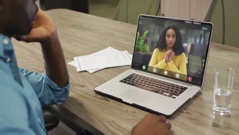 African-american-businessman-using-laptop-for-video-call-with-african-american-business-colleague