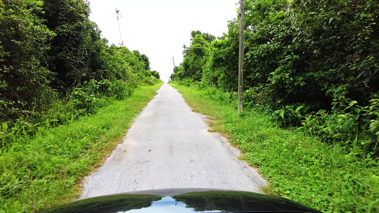 Beautiful View Drive Along Sempadi Lundu Coastal Road with Green Forest and Mountain,Sarawak,Borneo.