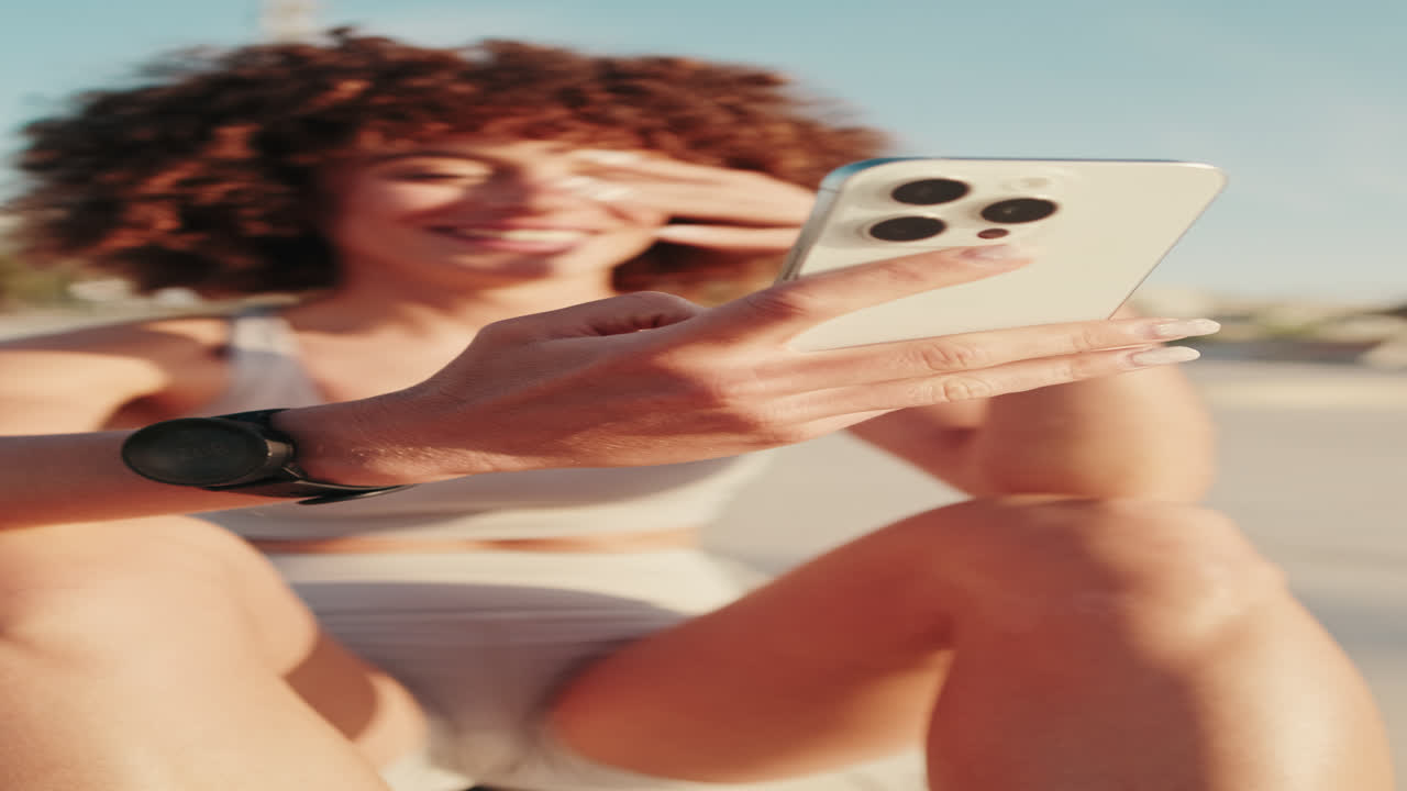 Sportswoman Using Smartphone After Workout