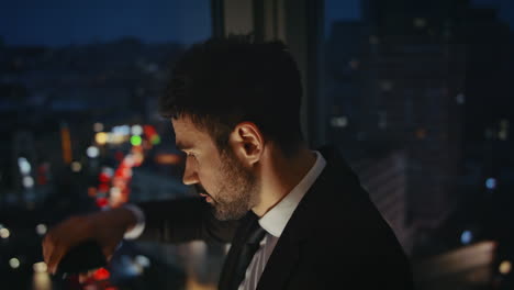 desperate manager standing office window feeling stress after phone call closeup