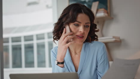 Confident lady calling partners looking on business deal at workplace closeup
