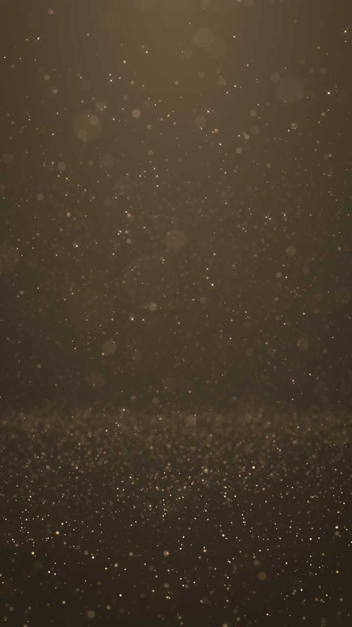 Golden dust particles moving gently across dark backdrop creating elegant sparkle effect perfect for
