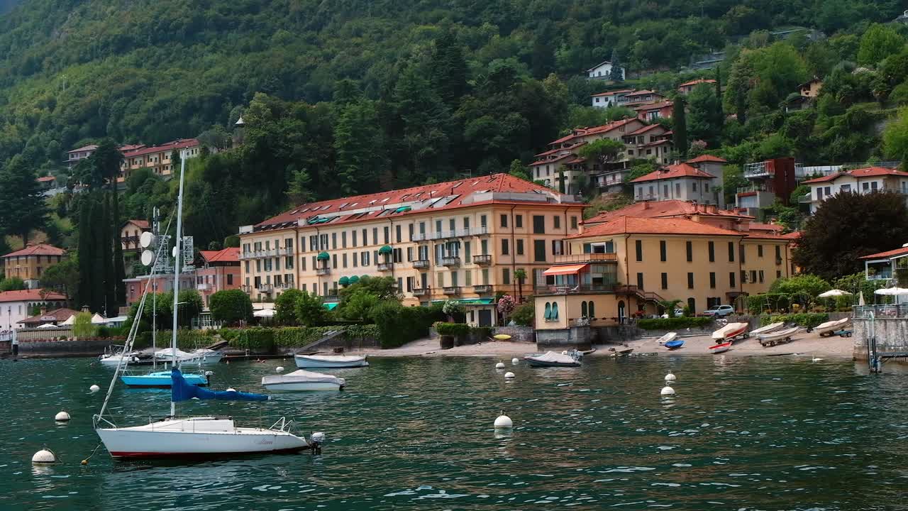 Picturesque Lake Scene with Boats and Buildings