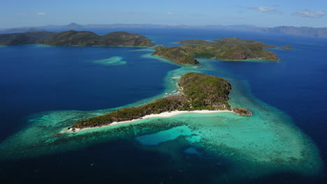 Aerial-view-of-Malcapuya-Beach-island-in-a-sunny-day,-Coron,-Palawan,-Philippines