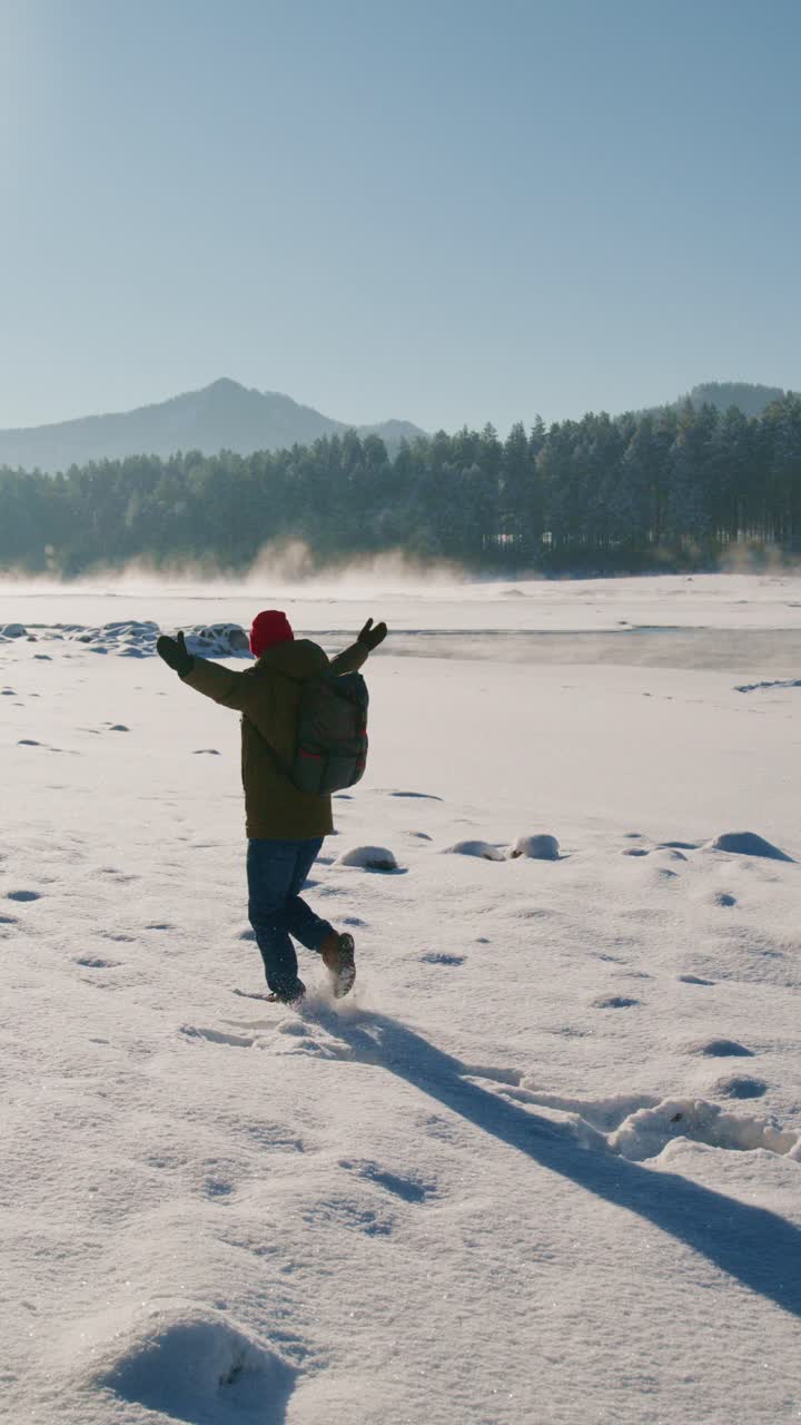 Winter exploration in snowy mountains with joyful gesture