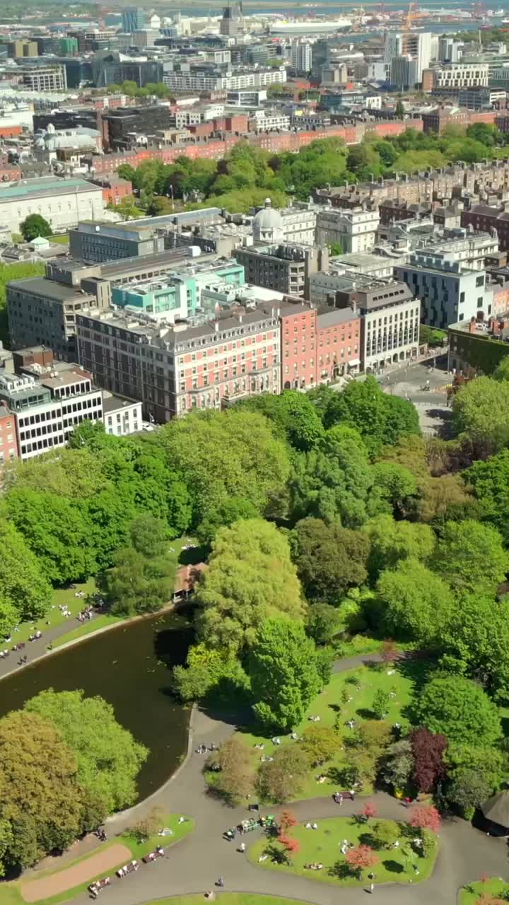 Social ratio aerial video of the cityscape of Dublin City Centre and St Stephen's Green in Dublin, Ireland on a bright and sunny day. Filmed in 1080x1920 and with Rec709 color