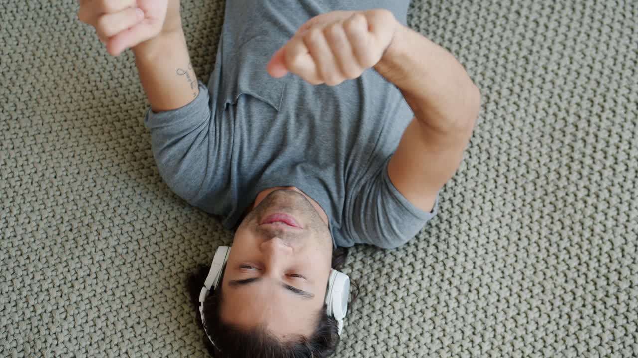 Man Relaxing and Listening to Music