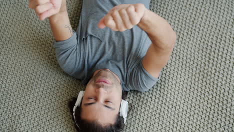 man relaxing and listening to music