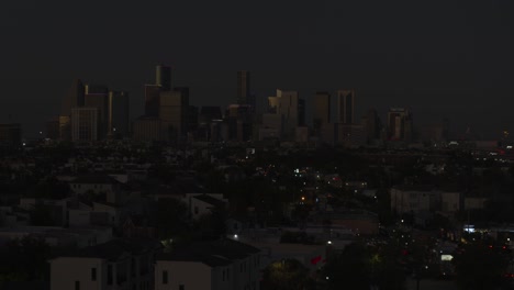 establishing drone shot of downtown houston and the 3rd ward area at night