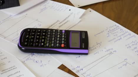 person working on documents at a table