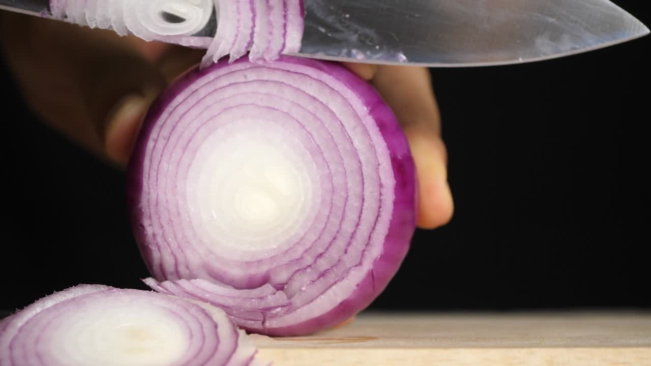 Chef slices shallot for cooking