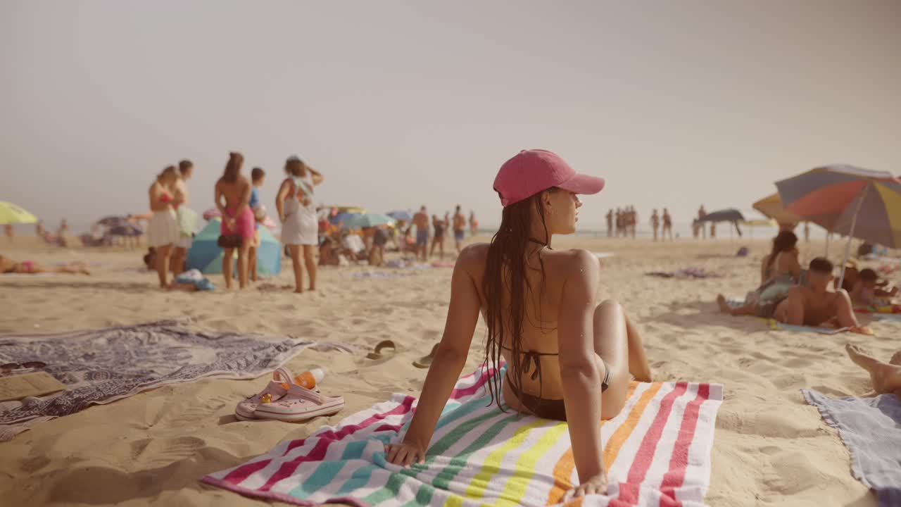 Woman sunbathing on a beach