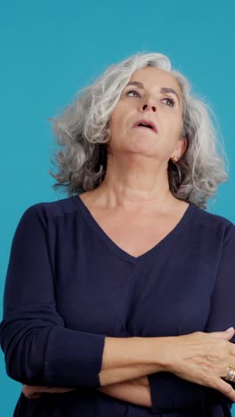 a mature woman displaying a range of emotions from thought to confusion