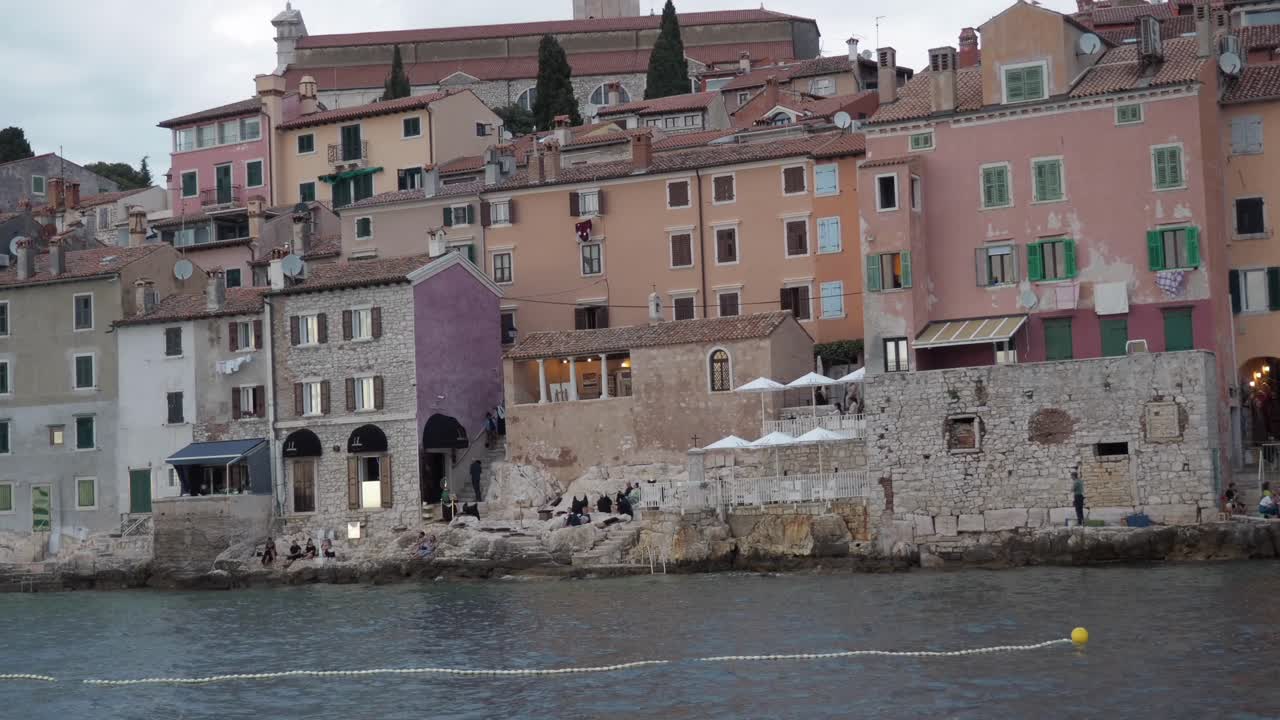 A stunning view of Rovinj's coastal charm, showcasing picturesque buildings and deep blue waters.
