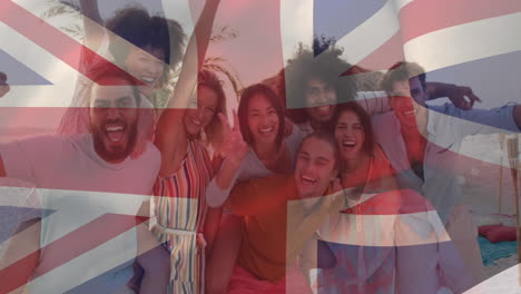 animation of diverse friends at beach party over flag of great britain