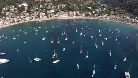 Many-yachts-anchoring-in-Port-de-Sóller-sea-harbor-bay-in-Mallorca