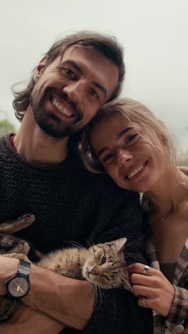 happy couple with a cat