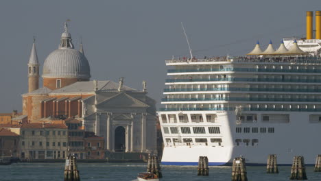 cruise liner sailing by church of the santissimo redentore in venice italy