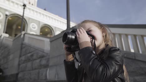 girl taking pictures outdoors