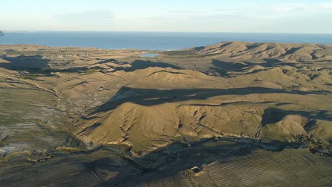 aerial view of a mountainous landscape with a coastline