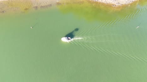 aerial view of boat navigating river