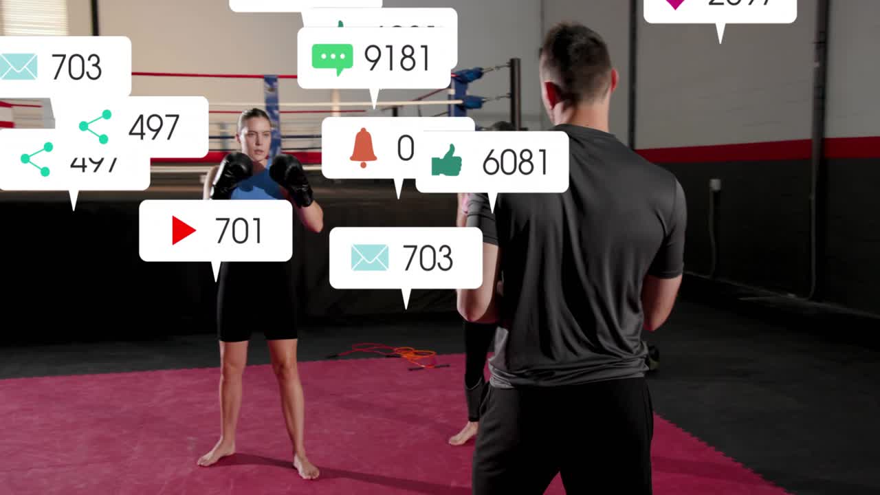 Coach cueing boxing drill, trainees throwing jabs, notification icons covering people showing reach