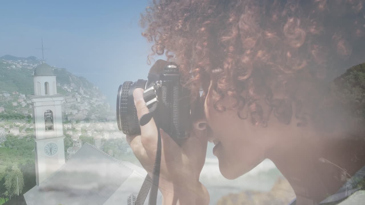 Animation of african american woman using camera, over cityscape